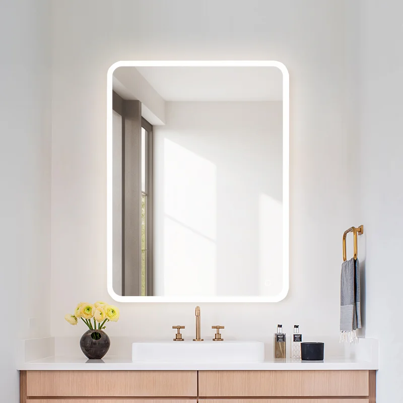 Frameless smart LED bathroom mirror with integrated touch controls and uniform vanity lighting.