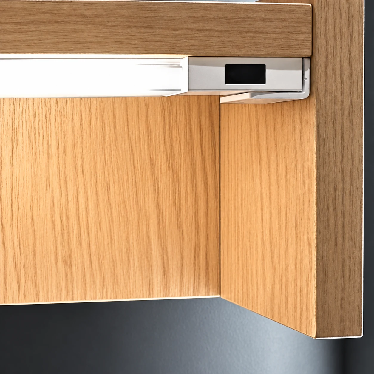 LumiFrost integrated IR door sensor installed inside a furniture cabinet